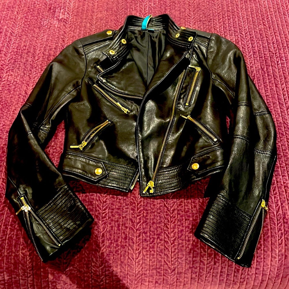 Black leather jacket with gold hardware